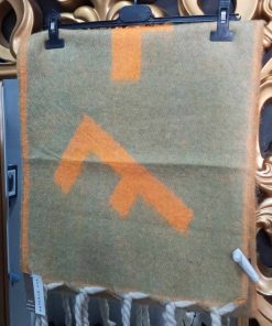PAÑOLETA CON DETALLES TRENZADOS M.31/VERDE Y NARANJA