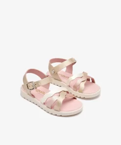 Sandalias niña tiras onduladas en dorado, con hebilla al tobillo y suela flexible