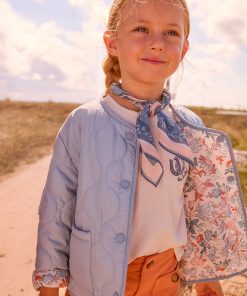 Chaqueta acolchada reversible niña en celeste, se lleva por las dos caras