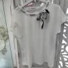 CAMISETA BLANCA MANGA CORTA CON LAZO AZUL M.LA2