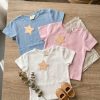 CAMISETA UNISEX CON CORCHETES EN HOMBRO BEBÉ M. BÁSICA COLOR BLANCO LOLITAKIDS