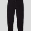 Pantalón jogging niño negro de algodón con pelo interior, cintura regulable y corte ajustado
