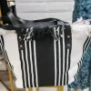 BOLSO PLAYERO ESTAMPADO RAYAS VERTICALES NEGRAS M.BP/RN