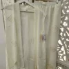 CONJUNTO DE DOS PIEZAS ESTAMPADO GEOMÉTRICO BLANCO ROTO M.ESTA-GEO12 6 Conjunto de dos piezas blanco roto con blusa abierta y pantalón de cordón
