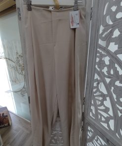 Pantalón bombacho beige de mujer con cintura elástica y pernera amplia